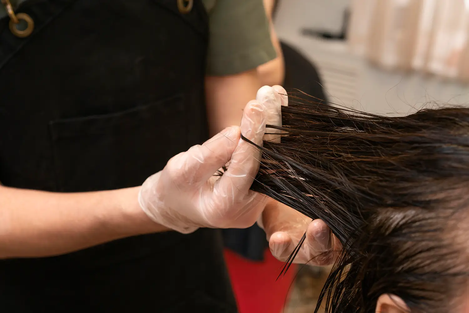 Professional complex hair color correction process by an expert stylist at Melenas hair salon
