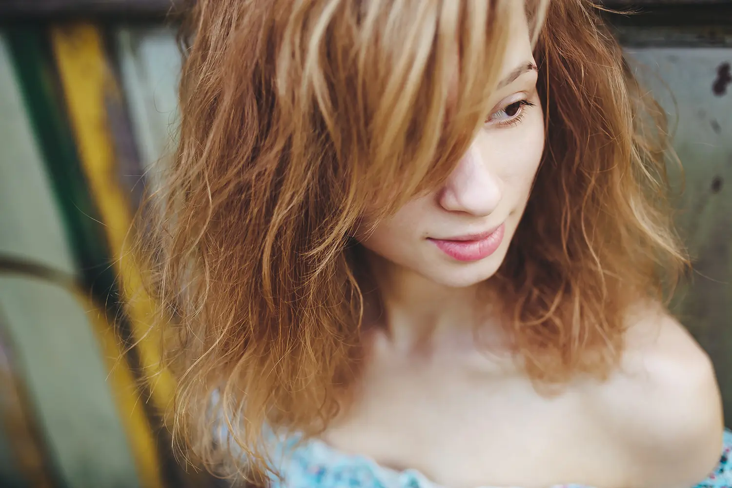 Textured Wolf Cut haircut with curtain bangs at Melenas hair salon
