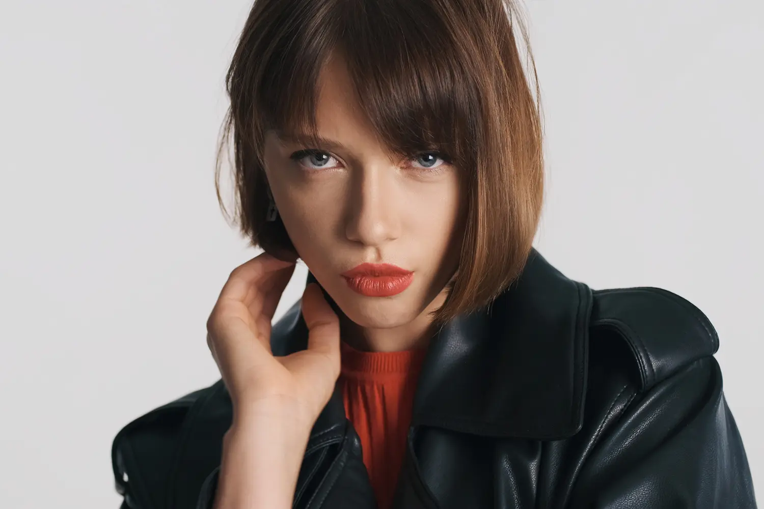 Stylish Curtain Bangs hair look with soft face framing at Melenas salon